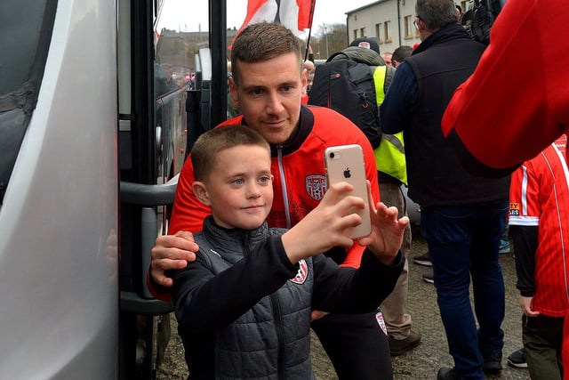 Derry City’s captain has his picture taken with a fan on Saturday morning prior to the team’s departure for Dublin ahead of tomorrow’s FAI Cup Final against Shelbourne. George Sweeney.  DER2244GS – 55