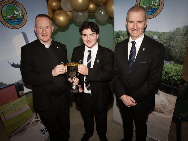 Séan McLaughlin receiving The Derry Charismatic Service Committee Prize from Fr Séan O’Donnell, School Chaplain (left) at the St. Columb's College Senior Prizegiving. On right is Mr FJM Madden, Principal, St Columb’s College.