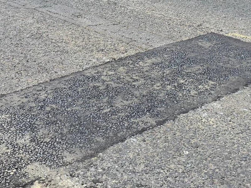 The Department of Infrastructure has repaired the potholes, which had been nicknamed the 'Strand Canyon'.