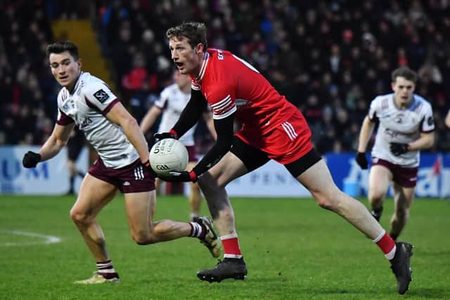 Galway’s Finnian "Laoí tracks Derry’s Brendan Rogers.  Photo: George Sweeney