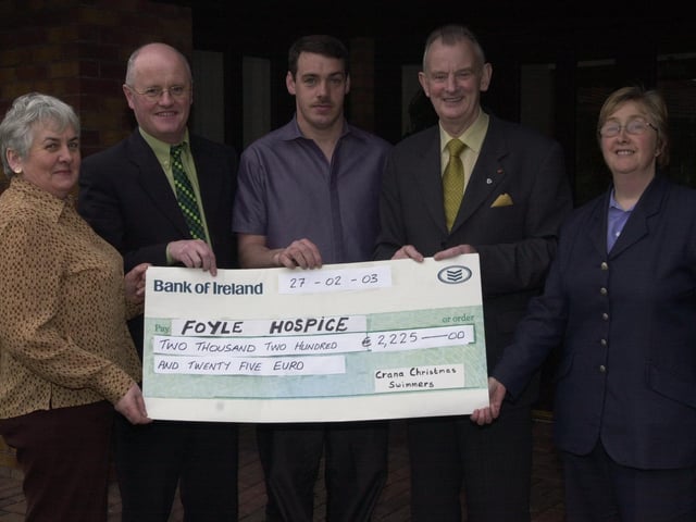 Dr Tom McGinley with others at a Foyle Hospice cheque presentation