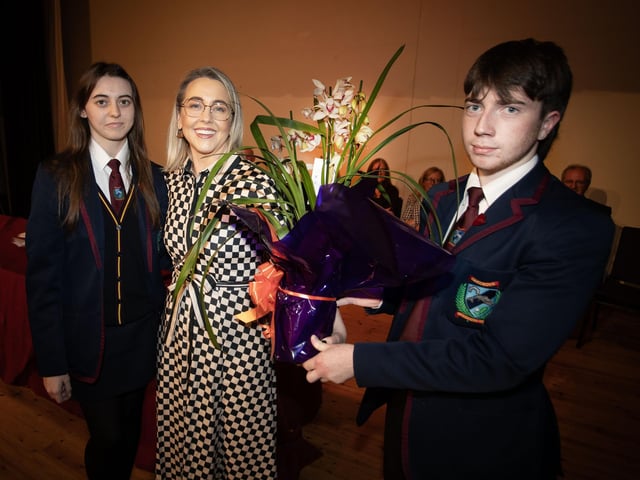 Mrs. Kellie-Marie Martin, Vice Principal , being presented with a bouquet of flowers by Deputy Head Girl and Boy, Amy and Daire at the recent Oakgrove Integrated College Junior Prizegiving. (Photo: Jim McCafferty Photography)