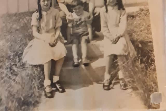 Frankie Carlin as a young boy with his two sisters Angela and Alice with their father Thomas at the Prefab bungalows.