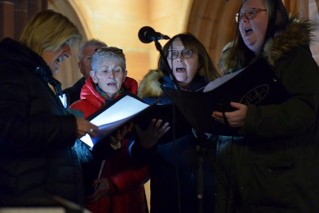 Choir singing at a candlelit vigil, held at Guildhall Square on Monday evening, to remember those who died in the Creeslough tragedy on Friday afternoon last.  Photo: George Sweeney.  DER2241GS – 55  