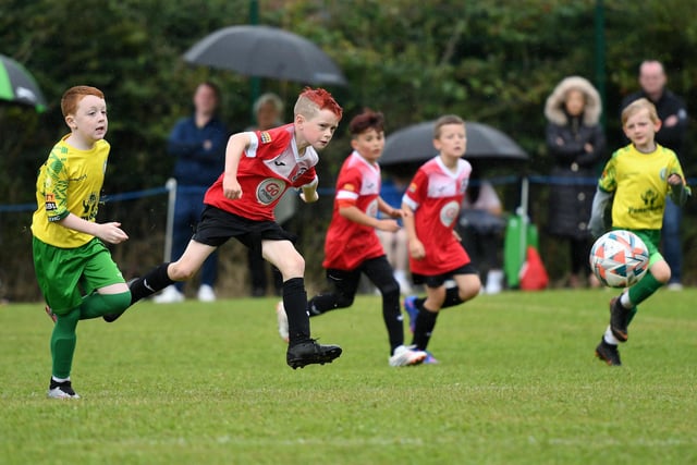 Maiden City Colts Under-9's player Luke Gardiner volleys a shot a goal during their match against TOTHC Colts.