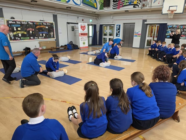 Children from St Paul's learning how to do chest compressions.