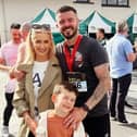 Stephen with fiancée Michelle and son Zach after completing the 2024 Waterside Half Marathon