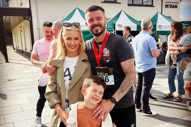 Stephen with fiancée Michelle and son Zach after completing the 2024 Waterside Half Marathon