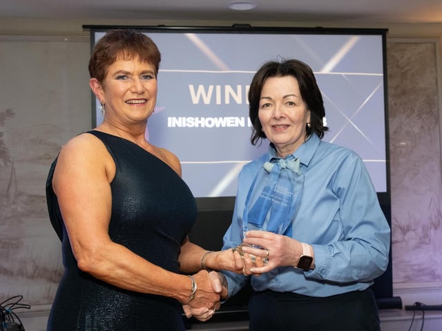 Sports Club of the Year Winner, Inishowen Rugby Club represented by Ann Scott receives the trophy from Madeline McLaughlin, Ballyliffen Lodge, Sponsor at the Carndonagh Traders Association Business and Community Awards in Ballyliffen Lodge Hotel on Saturday night last. Photo Clive Wasson