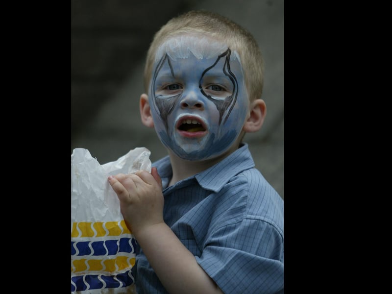 3 year old Shea Edwards enjoying some food despite the big tears in his eyes. (0306JB14)
