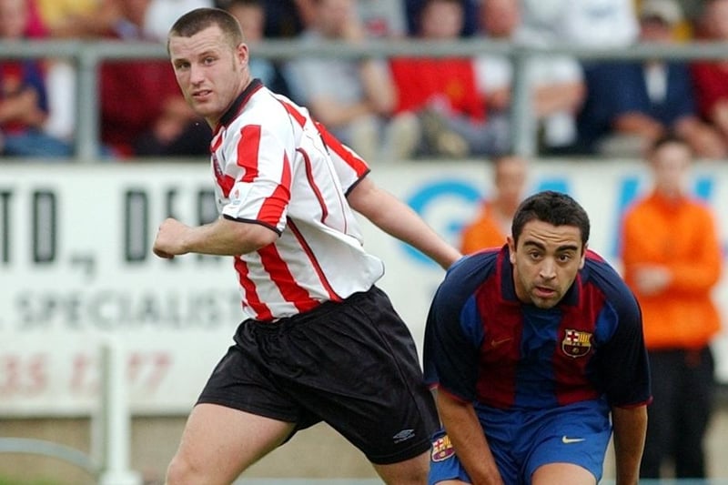 Michael Holt and Xavi Hernández in action.