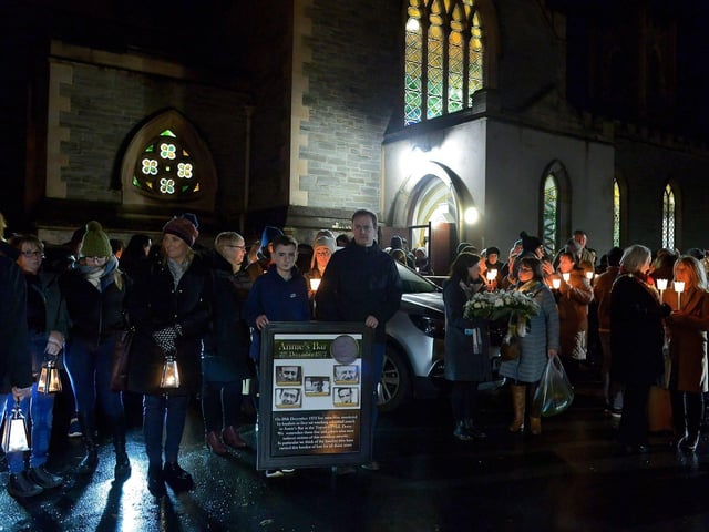 Relatives gather after mass at St Columba’s Church to take part in a wreath laying event, at Strabane Old Road, on the 50th Anniversary of the Annie’s Bar massacre on Tuesday evening. Photo: George Sweeney. DER2251GS – 11