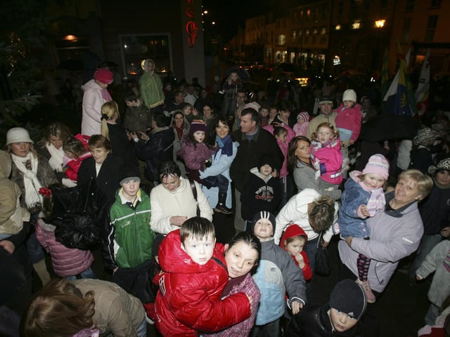 A section of the crowd that braved the wind a rain to see Santa switch on the Buncrana Christmas lights on Sunday. (2911C36) : Christmas in Inishowen in 2005.
