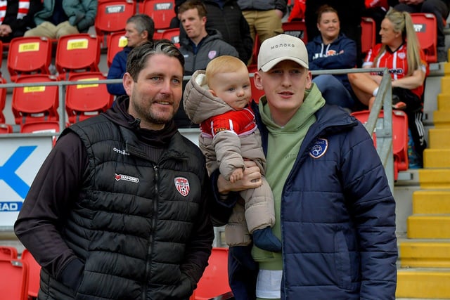 Derry City’s manager Ruaidhrí Higgins with former player Ronan Curtis, now with Portsmouth, and his 8 month old son Malachi at the Brandywell on Friday evening last. Photo: George Sweeney.  DER2320GS –130