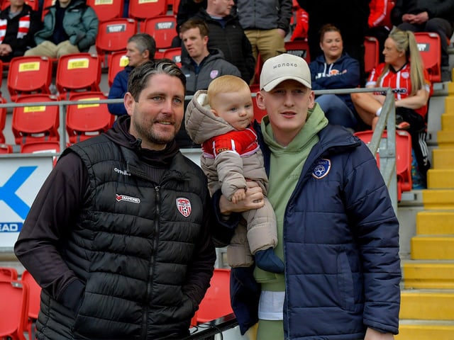 Derry City’s manager Ruaidhrí Higgins with former player Ronan Curtis, now with Portsmouth, and his 8 month old son Malachi at the Brandywell on Friday evening last. Photo: George Sweeney. DER2320GS –130
