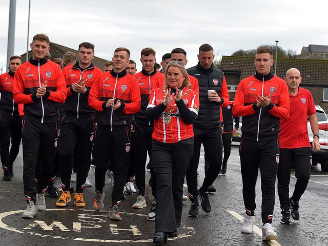 Mayor Sandra Duffy with Derry City players and staff on their way to greet fans gathered at Brandywell Stadium on Saturday morning prior to their departure for Dublin ahead of tomorrow’s FAI Cup Final against Shelbourne. George Sweeney. DER2244GS – 43
