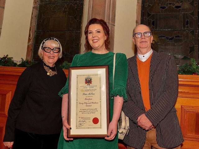 Lisa McGee, creator of Derry Girls, pictured with her parents Anne and Chris after she was conferred with the Freedom of Derry City and Strabane by a meeting of Full Council on Monday evening in the Guildhall. Photo: George Sweeney. DER2249GS