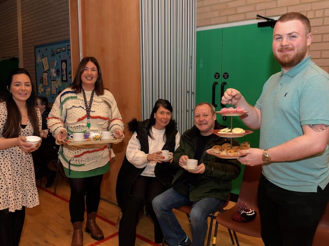 Bernie Sweeney and Declan McIntyre being waited upon by St John’s PS staff Natasha, Tara and Conor. Photo: George Sweeney