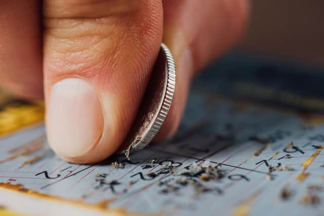 Scratch cards were reportedly stolen from two businesses on Sunday.