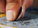 Scratch cards were reportedly stolen from two businesses on Sunday.