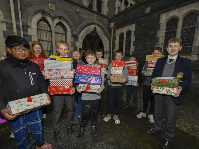Pupils from Lumen Christi College pictured with some of the hundreds of Christmas presents for Ukrainian children donated by pupils, their families and friends. This is the fourth year that pupils from the school have collected gifts for children of Ukraine. Photo: George Sweeney