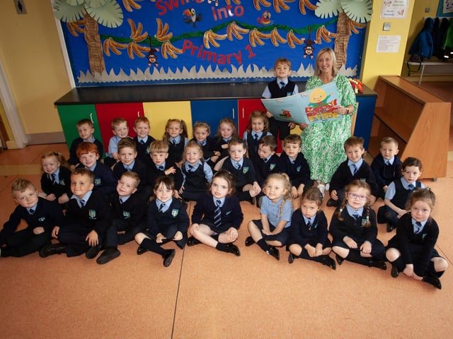 Mrs. Margaret Harkin pictured with her Primary One class at Hollybush Primary School. (Photos: Jim McCafferty Photography)
