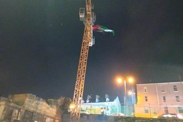A Palestinian flag was erected on a crane at the former Hamilton factory building on Friday.