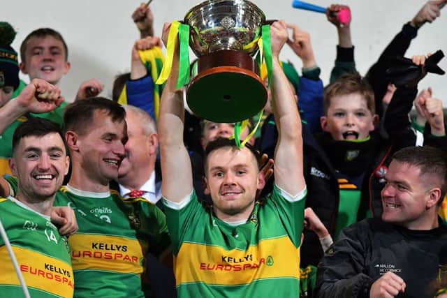 Glen captain Connor Carville lifts the O’Neill Senior Football Championship trophy after Sunday afternoon’s win over Maherafelt in the final at Celtic Park. Photo: George Sweeney
