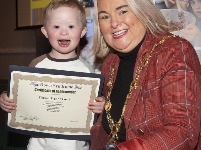 The Mayor Sandra Duffy presents young Tiernan Tyre-McCourt with his award.