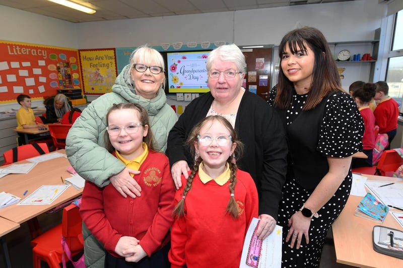Pupils Mollie and Abigail pictured with their grannies and Mrs. Catherine Doorish, Principal.