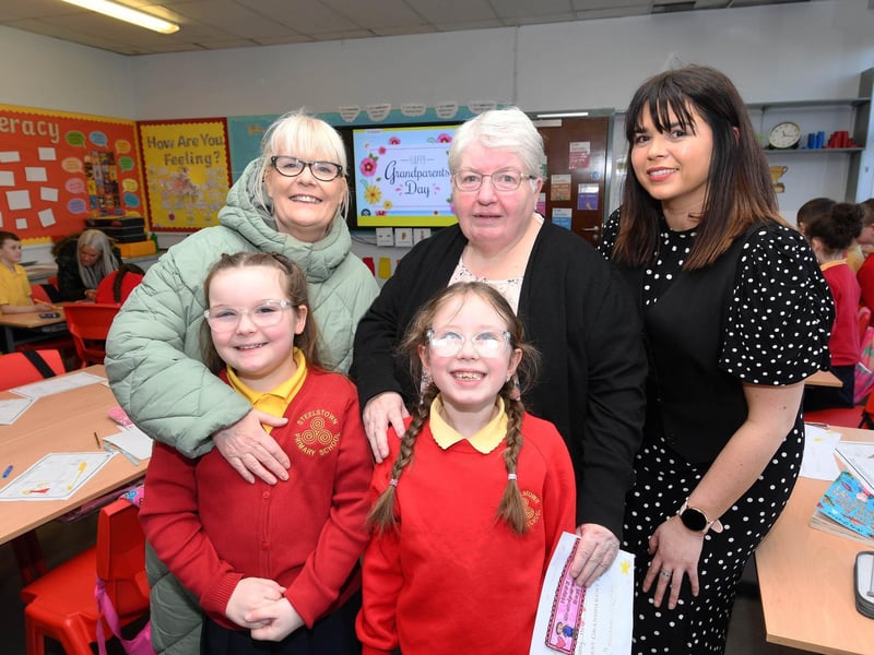 Pupils Mollie and Abigail pictured with their grannies and Mrs. Catherine Doorish, Principal.