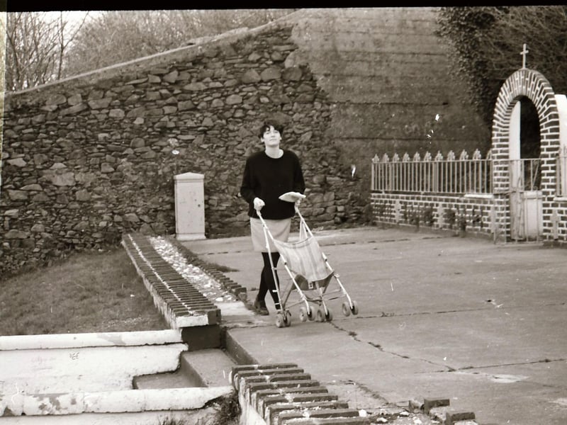 A local woman at the Brandywell Grotto in April 1994.