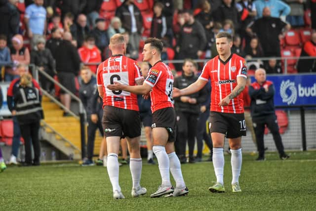 Danny Mullan consoles Mark Connolly after his penalty miss in the shoot-out defeat to St. Patricks Athletic. (Photo: George Sweeney)