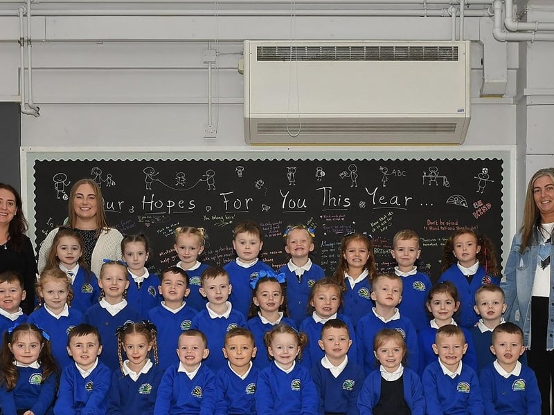 Miss Logue (left) with P1 pupils and classroom assistants at St Paul’s Primary School.