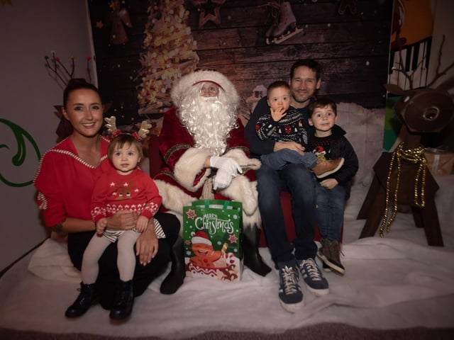 Jonah Craig and family meeting Santa Claus.