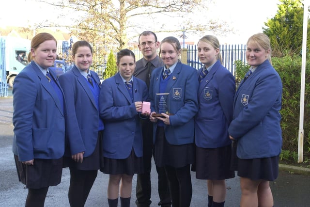 Pupils from St Mary's College with their Young Enterprise Award for best product, a mobile phone charger tidy. Included s technology teacher Gavin Molley.