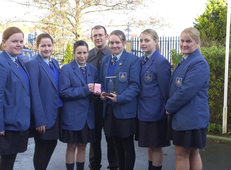 Pupils from St Mary's College with their Young Enterprise Award for best product, a mobile phone charger tidy. Included s technology teacher Gavin Molley.