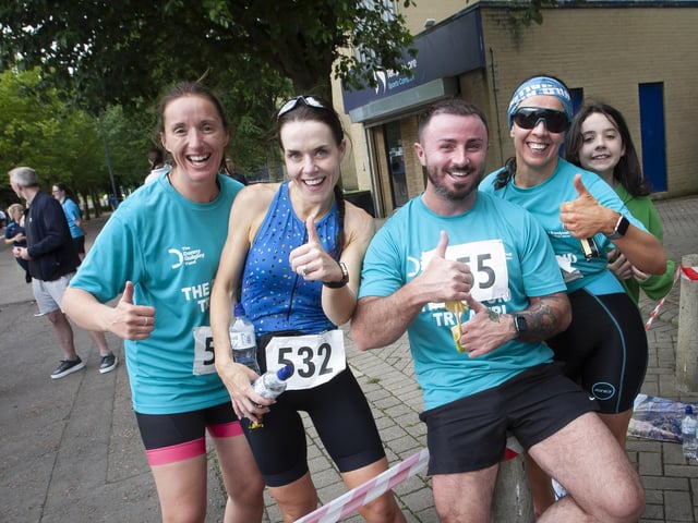 Some of Sunday’s participants take time out for a photo after crossing the finish line.