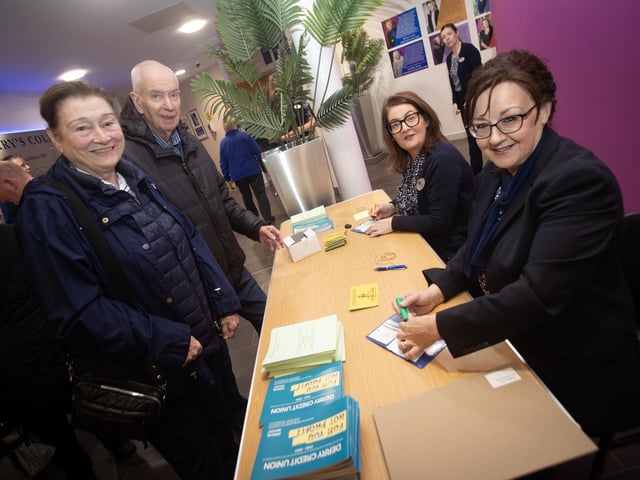 Derry Credit Union staff Karen Doran and Joanne Barr pictured with Gerard and Ellen Breslin at Monday's AGM at St. Mary's College, Derry. : .