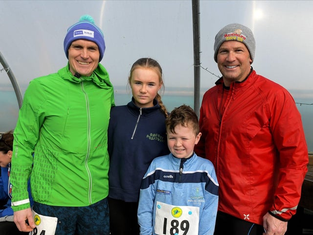 Stephen Browne, on the right, Maurice, Freya and Freddie Harkin took part in the Tomás memorial 5k fun walk / run held in Moville on Sunday morning. Photo: George Sweeney