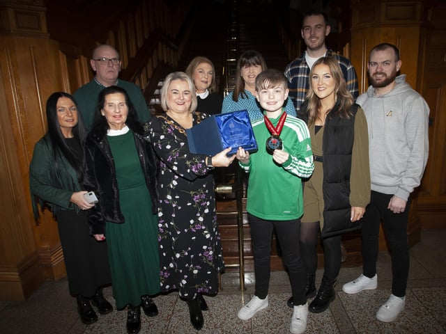 The Mayor of Derry City and Strabane District Council, Sandra Duffy making a special presentation to Strabane teenager Lucas O’Connell to mark his recent victory in the WUKF 12 Years Individual Boys Komite European Championship at a reception in his honour at the Guildhall on Tuesday evening last. Included are Lucas’ parents, grandparents, relatives and coaches.
