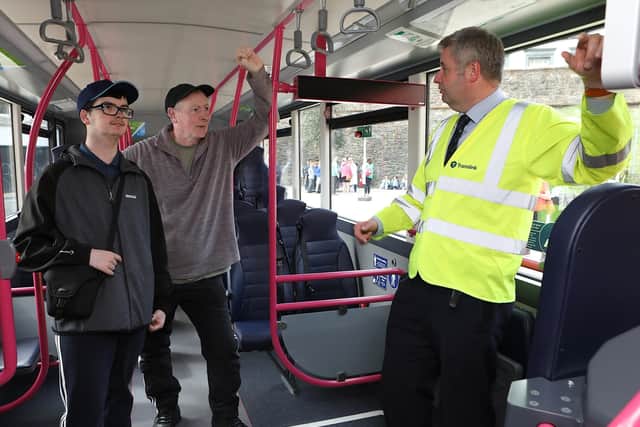 Will Campbell, Translink, chatting to John McMenamin and his son Daniel on board on of Translink's Zero Emission Foyle Metro buses at the preview event held in Guildhall Square, Derry on Thursday May 25. (Photo - Tom Heaney, nwpresspics)