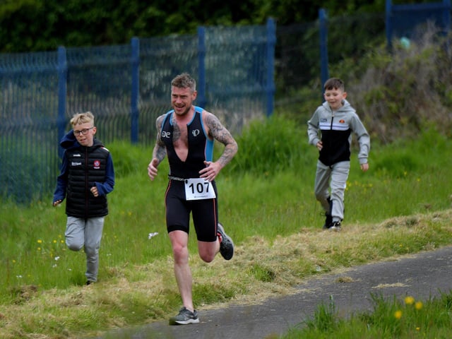 Colin McCormack has some competition during the Liam Ball Triathlon on Sunday morning.