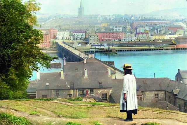 A young girl looks towards St Columb’s, a Church of Ireland cathedral built in Derry City after the reformation. It was the first non-Roman Catholic cathedral to be built in Western Europe. The old walled city lies on the west bank of the River Foyle, which is spanned here by Carlisle Bridge, which was replaced in the 1930s by Craigavon Bridge. Derry was one of the main emigration ports from Ulster to the USA in the nineteenth century. 
Photographer: Underwood & Underwood; Source: Library of Congress. Old Ireland In Colour 3 by John Breslin and Sarah Anne Buckley is published by Merrion Press