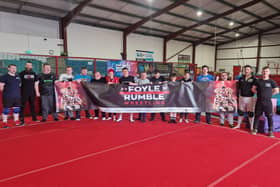 Members from Tuned In Project Derry and wrestlers from Complete Anarchy Wrestling (CAW) who will take part in Saturday's Foyle Rumble event at the City Hotel.