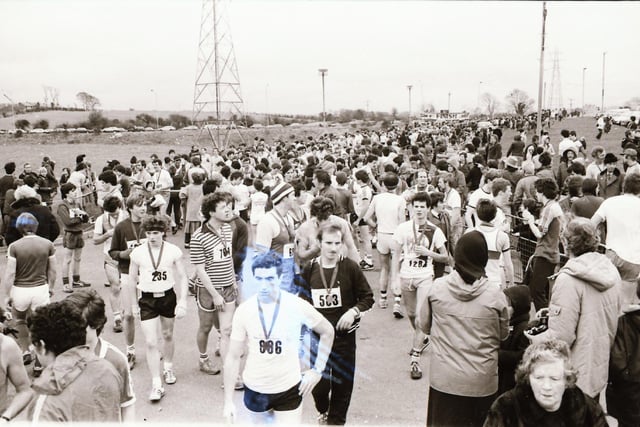 Participants and spectators pictured at the end of the 1983 Male Mini Marathon in December 1983.