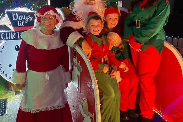 Mr and Mrs Claus with their elves at Amelia Court