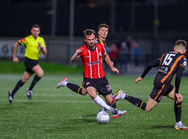 Cameron Dummigan takes the ball past Dundalk's Darragh Leahy.