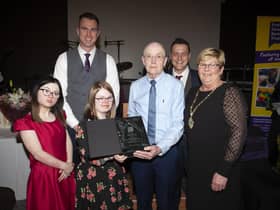 Lauren Corbett makes a special presentation to Mr. Gerry Craig, one of the founding members of the Foyle Down Syndrome Trust, at Friday night’s Gala Ball. The award was presented in recognition of Gerry’s passion, determination and commitment to the founding of the Foyle Down Syndrome Trust. Included from left are Grace Kirk, Christopher Cooper, manager, FDST, Councillor Graham Warke and Deputy Mayor Angela Dobbins. (Jim McCafferty Photography)