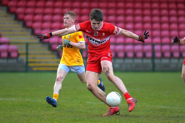 Ryan McNicholl scores the first of his two goals for Derry against Antrim. Photo: George Sweeney